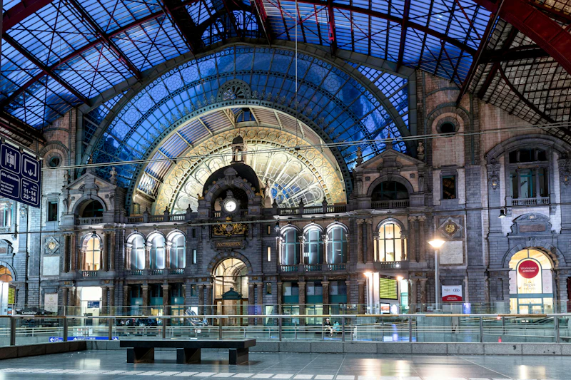 Grand interior of a historic train station at night