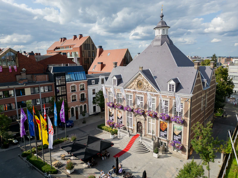 An aerial view of a town square with a clock tower